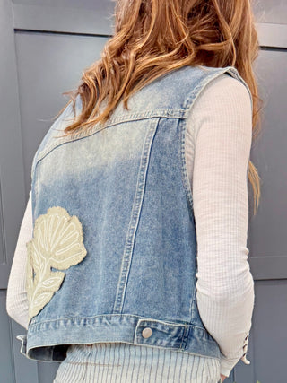 Side-back view of the Free Fallin' Flower Quilted Patchwork Denim Vest showing the button and stitching detail