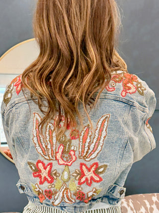 Back view showing the cropped length of the 9 to 5 hand-beaded denim jacket