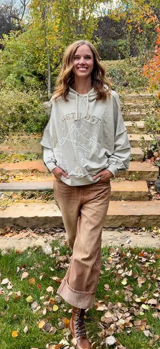 Get Lost hoodie in Soft Stone styled with Off the Cuff barrel leg pants on stone steps