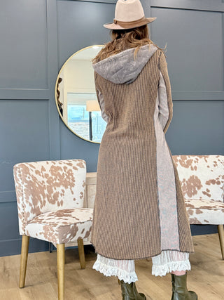 Back view of the Long Cool Woman hooded waffle jacket showing the hood and long length