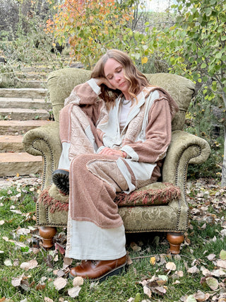 Relaxing in the Peaceful Easy Feelin' lounge set in a vintage armchair among fall leaves