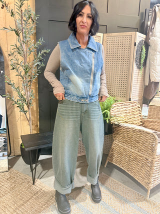 Full-length front view of the ROOTED & Rare Denim Vest with wide-leg jeans