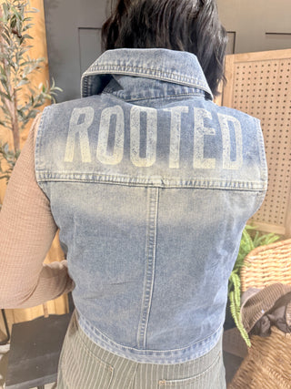 Back of the ROOTED & Rare Denim Vest showing ROOTED printed across the shoulders
