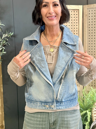 Front of the ROOTED & Rare Denim Vest, worn open over a taupe thermal